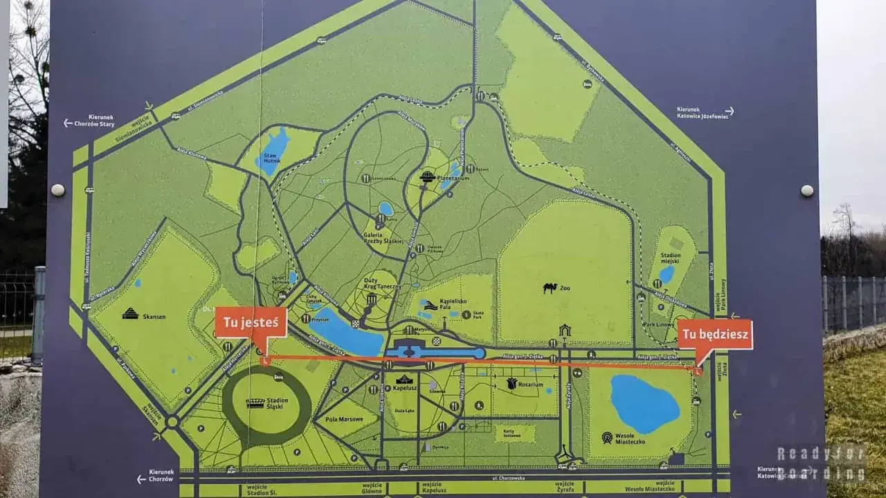 Mapa Parku Śląskiego z zaznaczonymi atrakcjami dla dzieci: zoo, planetarium, wesołe miasteczko. Wskazuje Twoją aktualną lokalizację i drogę do celu.
